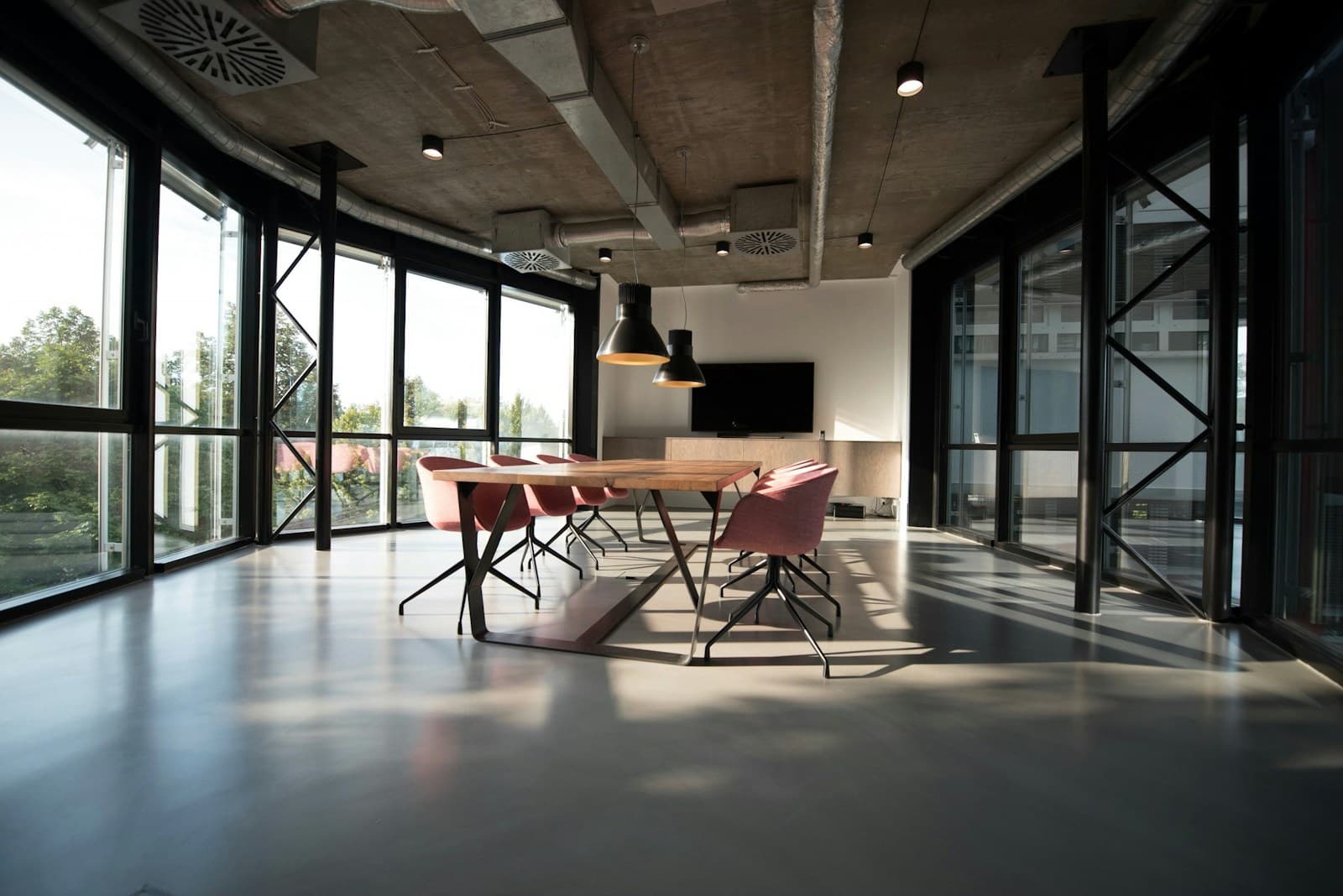 Contemporary commercial meeting space with glass walls